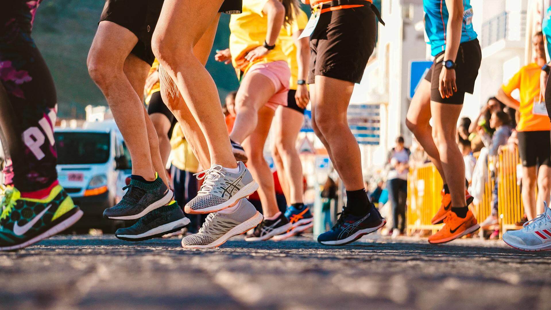 Close up of running shoes on runners warming up for a race