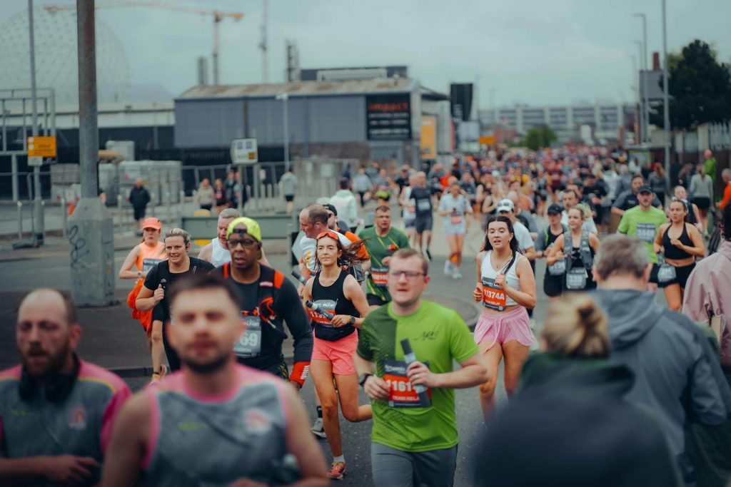 beginner runners at one of the best UK marathons with crowd support lining the streets