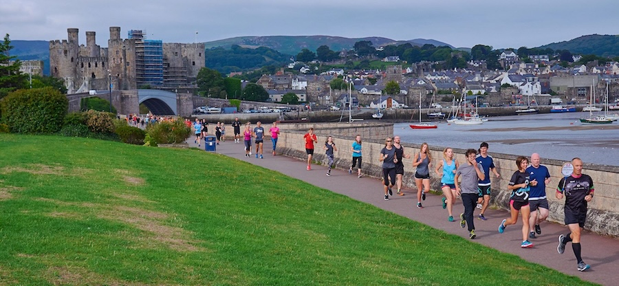 parkrun tourism uk runners at a castle parkrun course in wales