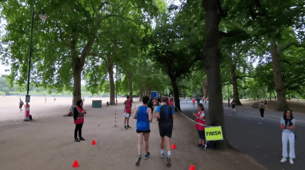 runners following parkrun rules at the finish funnel of a uk parkrun event