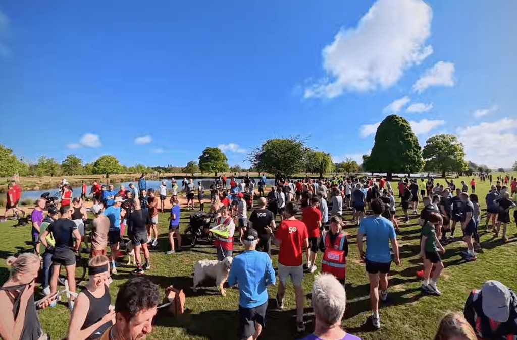 Parkrun Milestones and T-Shirt Colours Explained runners wearing milestone t-shirts at the finish funnel