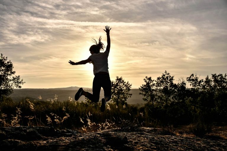 A runner celebrating a personal best (pb) at parkrun