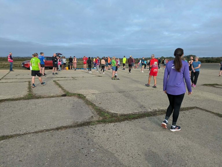 First parkrun what to expect: runners gathered at the start line before the 9am briefing